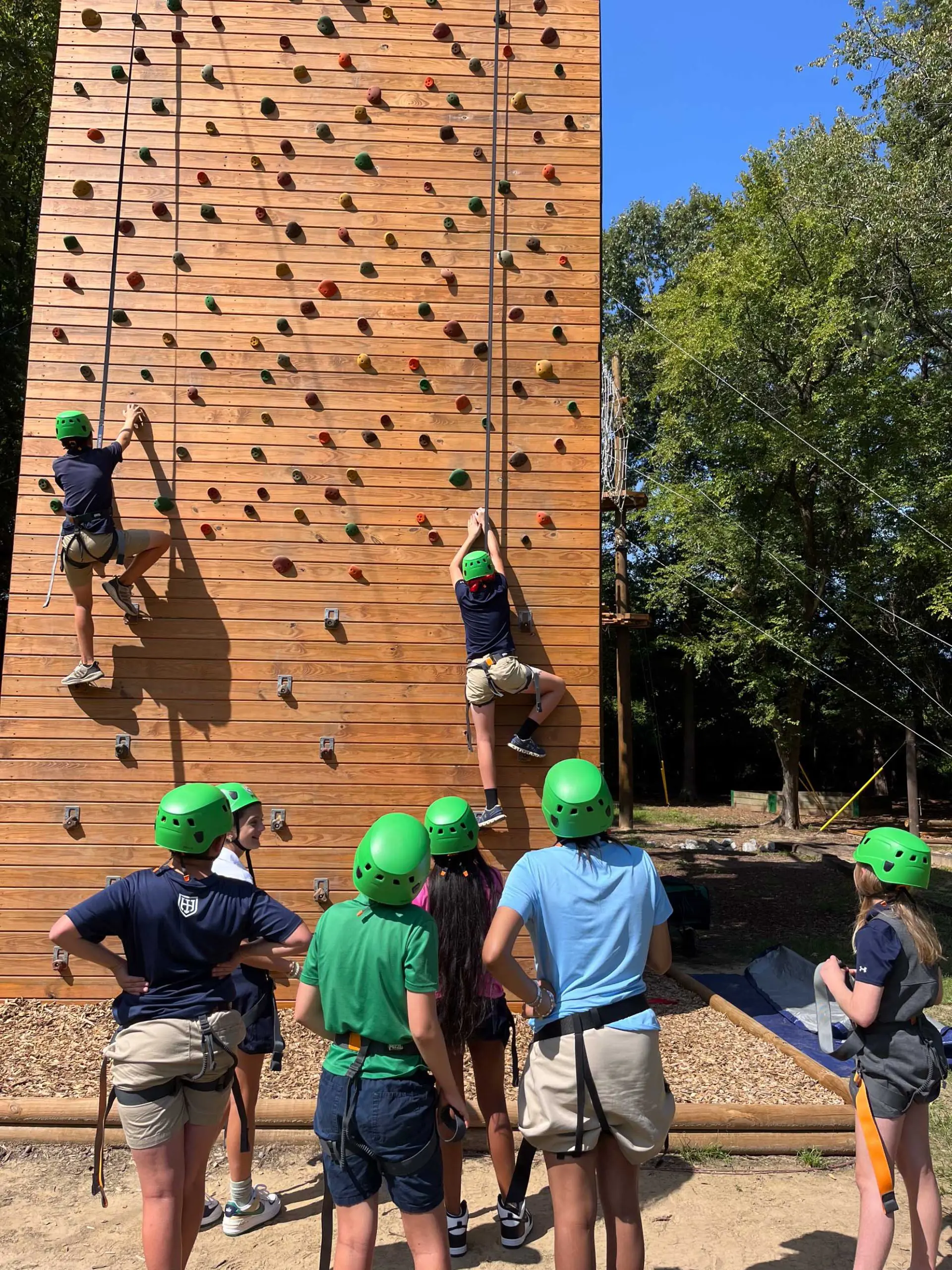 students climbing outdoors