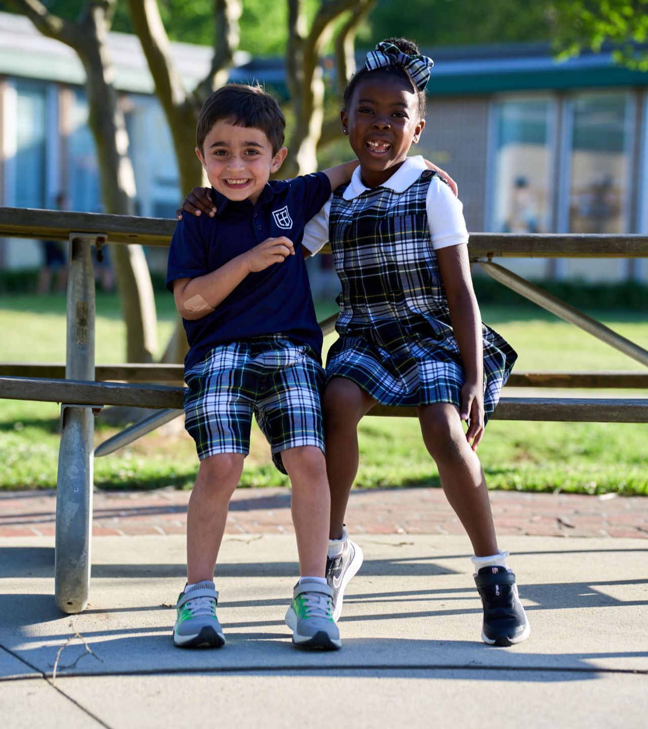 two lower school students sitting